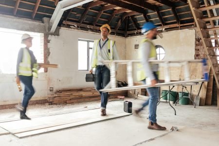 Construction worker, busy and team working building development, maintenance and property upgrade t.